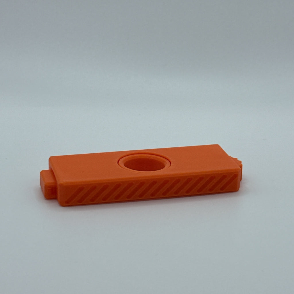 Orange Fidget Fusion fidget toy on a light gray background
