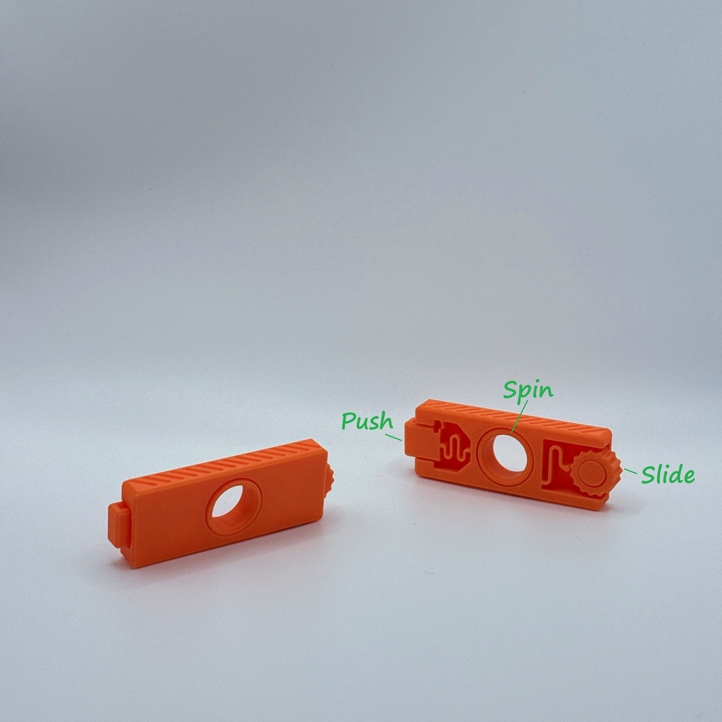 Two orange Fidget Fusion fidget toys with labeled actions text.